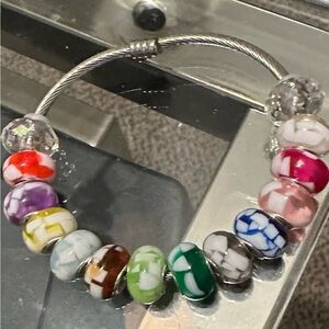 Silver bracelet with charms